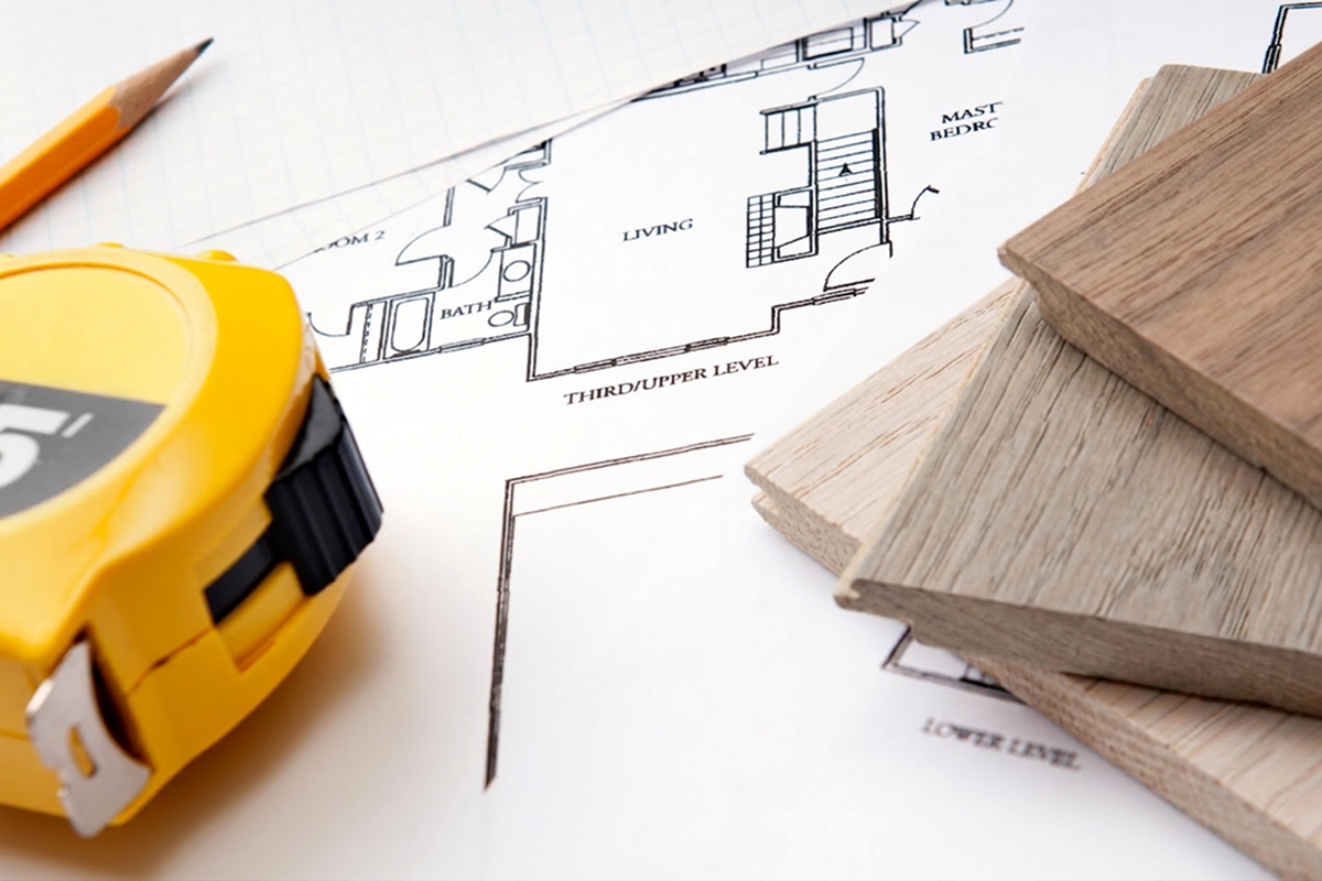 how to buy flooring online picture of measuring tape, pencil, floor plan, and hardwood samples